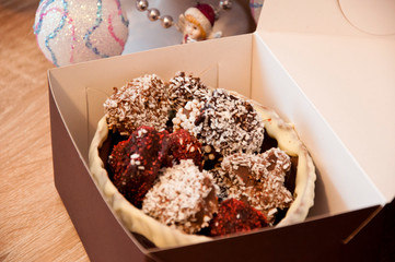 candy shop. sprinkles and topping. homemade chocolate. sweets at christmas tree. happy new year. xmas gift. Homemade candy in chocolate basket. sweet souvenir present. Truffles and Marzipan in box