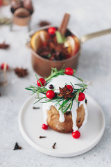 Christmas festive pound cake decorated with cranberries almonds and rosemary twigs