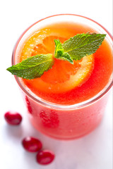 Fresh Homemade Cranberry Orange Juice with Mint Garnish