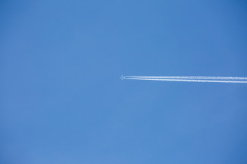 Airplan flies in a blue sky