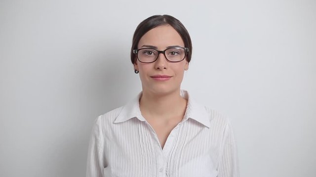 Portrait of a business woman in glasses. Close-up of a pretty woman on a white background.