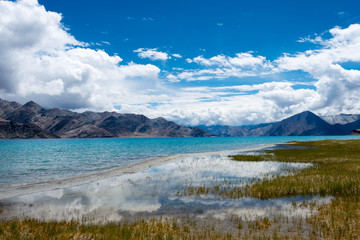Fototapeta na wymiar Ladakh, India -Aug 06 2019 - Pangong Lake view from Between Kakstet and Chushul in Ladakh, Jammu and Kashmir, India. The Lake is an endorheic lake in the Himalayas situated at a height of about 4350m.