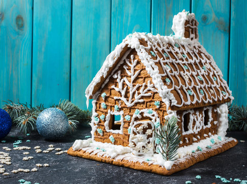 Homemade gingerbread house on stone background. Christmas
