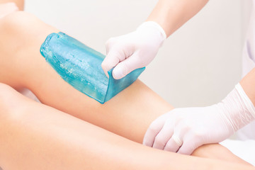 azulene depilation. wax hair removal, shugaring. concept of smooth skin without hair. azulene of...