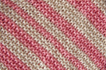 white and pink knitted stripes background