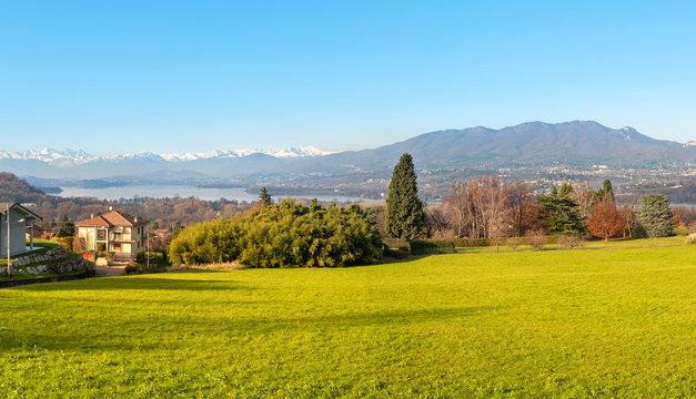 Landscape with view of Lake Varese and snow capped mountains from Azzate Belvedere, province of Varese, Italy