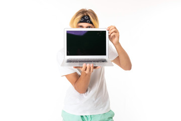 Stylish caucasian blonde man shows laptop isolated on white background