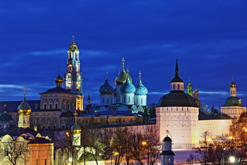 Fototapeta na wymiar Famous Russia Golden Ring landmark Trinity St. Sergius Lavra in winter night, beautiful Sergiev Posad bright photo on blue sky background from Observation deck