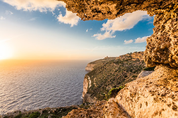 Sunset over cliffs in Malta.