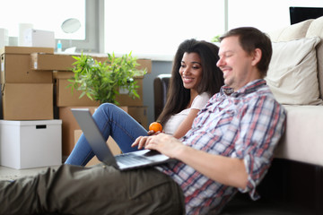 Diversity couple picks up new furniture for an apartment