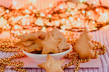 Christmas cookies on a blurry background of Christmas lights.