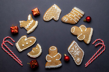 Gingerbread man. Xmas homemade Ginger, Honey cookies on dark background. Merry Christmas greeting card, banner. Winter holiday xmas theme. Happy New Year. Space for text