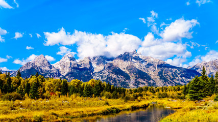 Fototapeta premium Reflections of the Grand Tetons Peaks in the waters of the Snake River at Schwabacher Landing in Grand Tetons National Park, Wyoming, United States