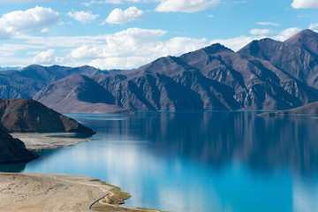 Ladakh, India - Aug 05 2019 - Pangong Lake view from Merak Village in Ladakh, Jammu and Kashmir, India. The Lake is an endorheic lake in the Himalayas situated at a height of about 4350m. - obrazy, fototapety, plakaty