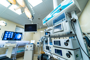 Medical devices and industrial lamps in surgery room of modern hospital. Interior hospital design concept