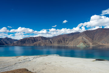 Obraz premium Ladakh, India - Aug 05 2019 - Pangong Lake view from Merak Village in Ladakh, Jammu and Kashmir, India. The Lake is an endorheic lake in the Himalayas situated at a height of about 4350m.