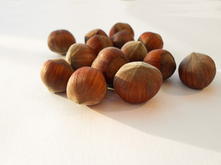 Closeup of hazelnuts, isolated on the white background.