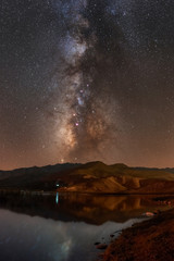 Long exposure of Milky way above desert with reflection in lake - 308120728