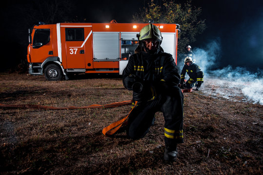 Fire Brigade In Action At Night Time