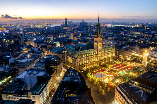 Hamburg at Christmas with the christmas market in the front of the town hall