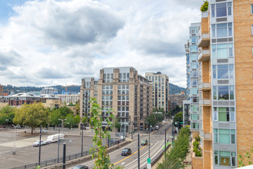 Life in Pearl District. Busy intersection next to apartment buildings in downtown Portland Oregon.
