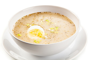  Sour rye soup on white background