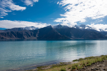 Naklejka na ściany i meble Ladakh, India - Aug 07 2019 - Pangong Lake view from Between Merak and Maan in Ladakh, Jammu and Kashmir, India. The Lake is an endorheic lake in the Himalayas situated at a height of about 4350m.