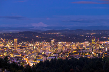 Fototapeta na wymiar City skyline in Portland Oregon. Cityscape buildings downtown Portland Oregon at dusk during blue hour seen from Pittoack Mansion.