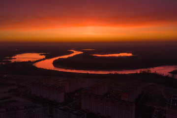 Bright red dawn over the city. Gomel at dawn. City shooting from above.