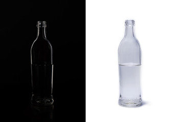 Double silhouette of a glass bottle on a black and white background . Empty space for your lettering.