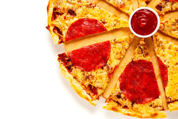 Sliced margherita pizza on white background