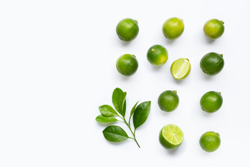 Fresh limes with leaves isolated on white