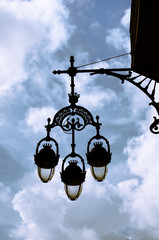Fototapeta na wymiar Old lantern on a house in Barri Gotic,