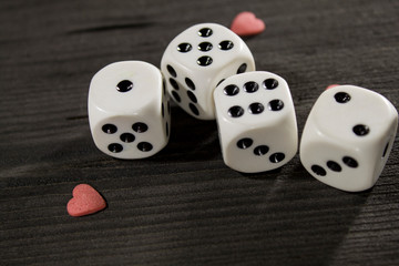 white cubes and small hearts on a black background
