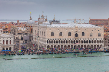 Fototapeta premium Aerial view of gondolas in front of Palazzo Ducale during high water, Venice, Italy