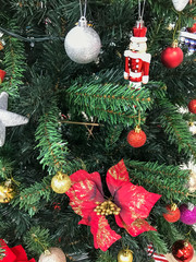 Fototapeta na wymiar Christmas tree decoration with different toys, New Year pine tree