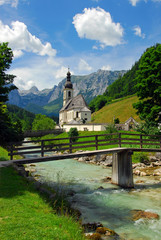 Fototapeta na wymiar Beautiful view of the Church by the river. Ramsau, Bavaria, Germany