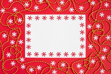 Christmas mockup with snowflakes and gold garland on red background. Happy new year. Space for text. Winter concept.