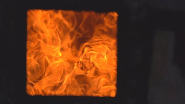 Slow motion hot fire flame burning dead people in cremation 