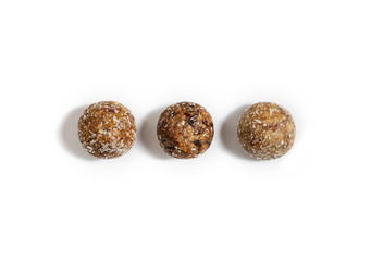 Homemade energy balls with dried apricots, raisins, dates, prunes, walnuts, almonds and coconut.