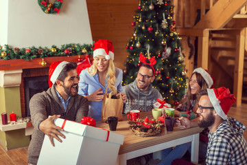 Friends exchanging Christmas gifts