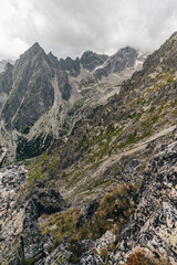 Alpine like mountain landscape of High Tatras, Slovakia. Kezmarsky stit, Lomnicky stit and other High Tatra peaks in autumn. Rocky mountains of High Tatras.