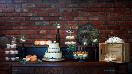 Decorated wedding tables with numbers on bottles and beautiful rose compositions on the tables