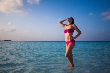 Young gorgeous woman in bikini on a tropical island