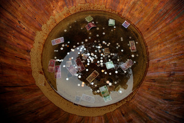 Obraz na płótnie Canvas Sacrificial money in a bronze bowl in Beihai Park, Beijing