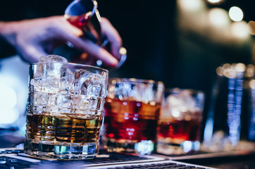 Set of red cocktail on bar counter