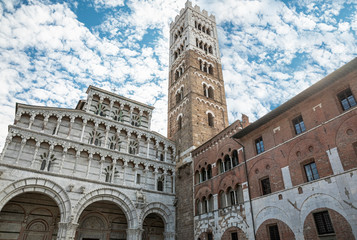 Romanesque Facade and bell tower of St. Martin  Cathedral in Lucca, Tuscany. It contains most precious relic in Lucca, Holy Face of Lucca