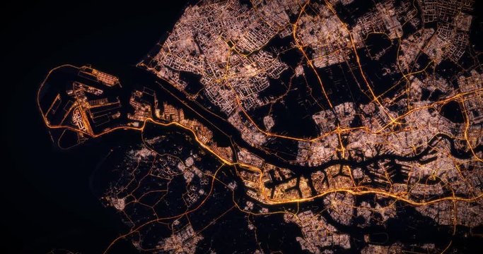 Aerial night view of city of Rotterdam Netherlans. Traffic and street light glowing. Camera flying high above, moving slowly forward from space filming cinematic straight down. 3d animation rendering.