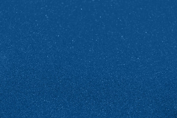 Sparkling festive blue holiday background. Celebration concept. Top view, horizontal