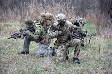 Military army soldiers tactical teamwork in forest